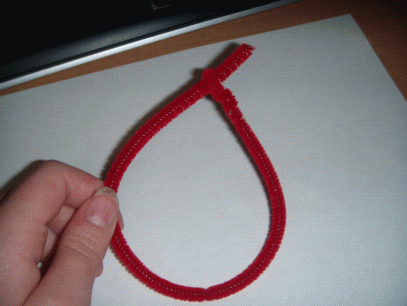 2 - Bend loose end around and thread it through the small loop